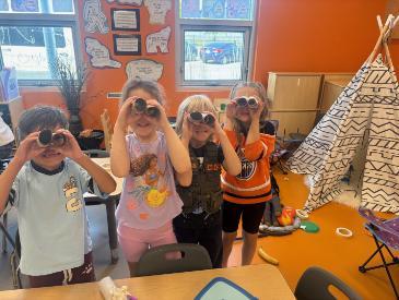 Div 1 Students with craft binoculars