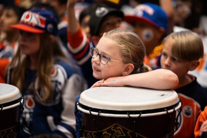 Student with drum in assembly